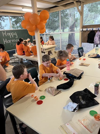 An iamge of students celebrating Harmony Day in the canteen.